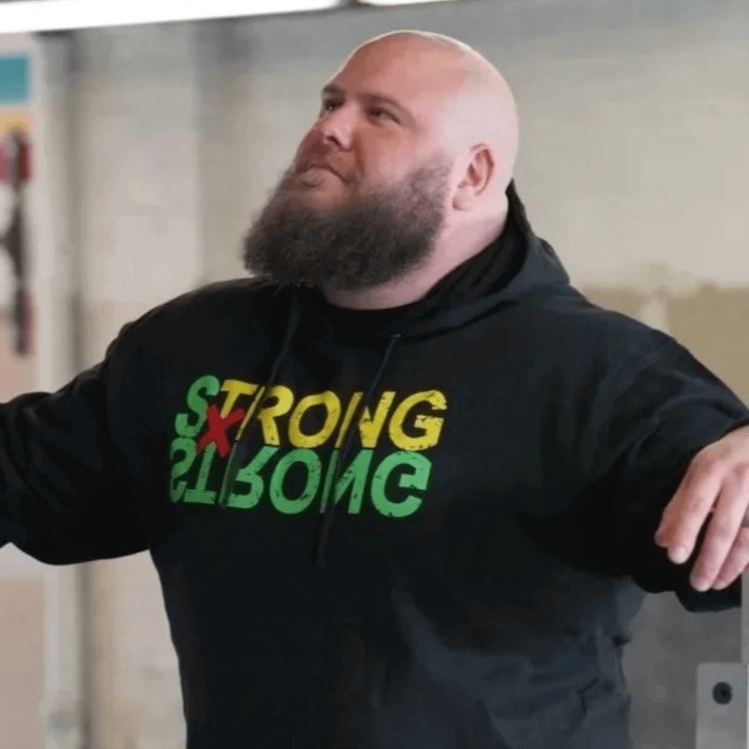 Athlete wearing Strong x Strong black anime inspired hoodie